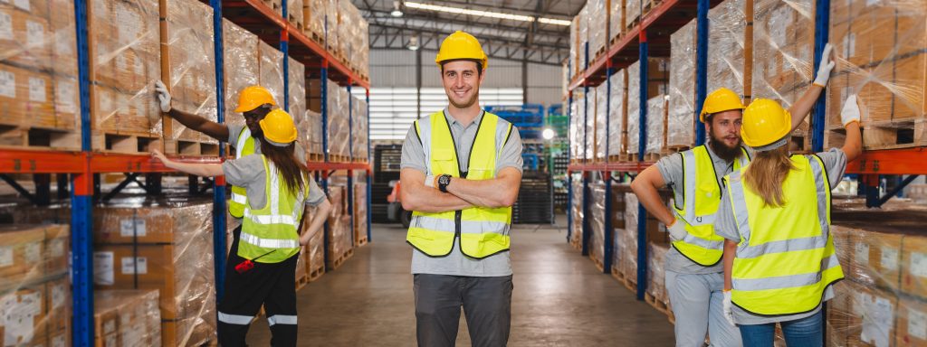 Industrial workers in a packaging and cardboard factory