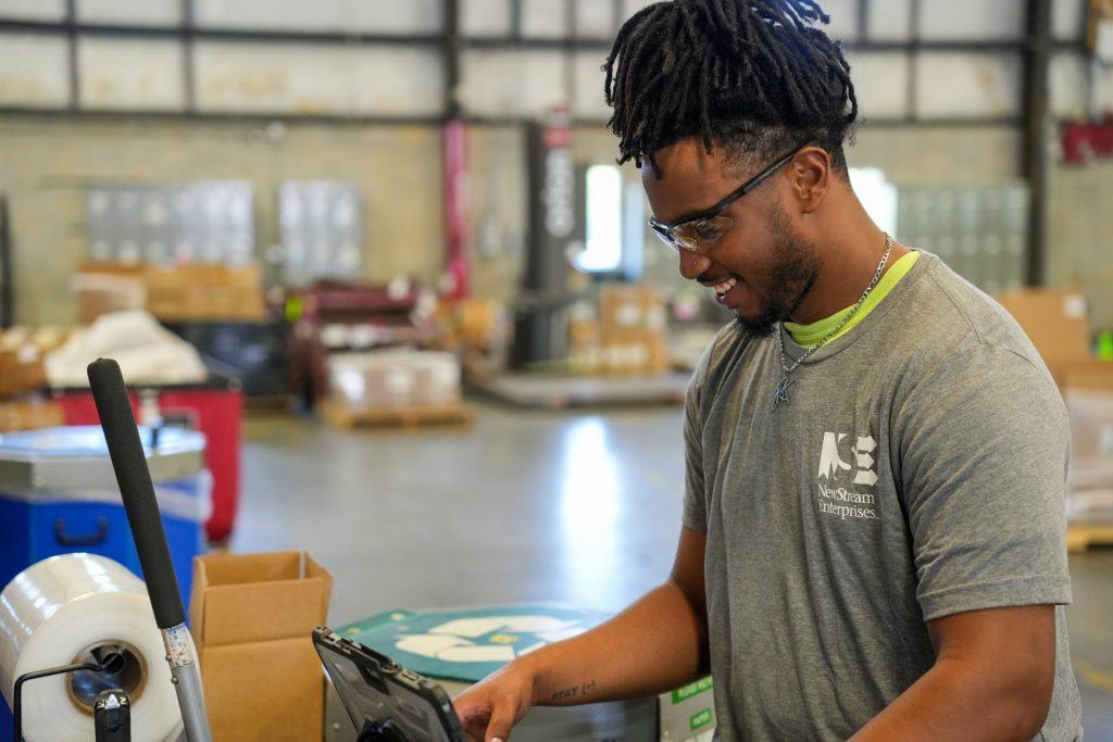 NewStream employee working in assembly and subassembly operations