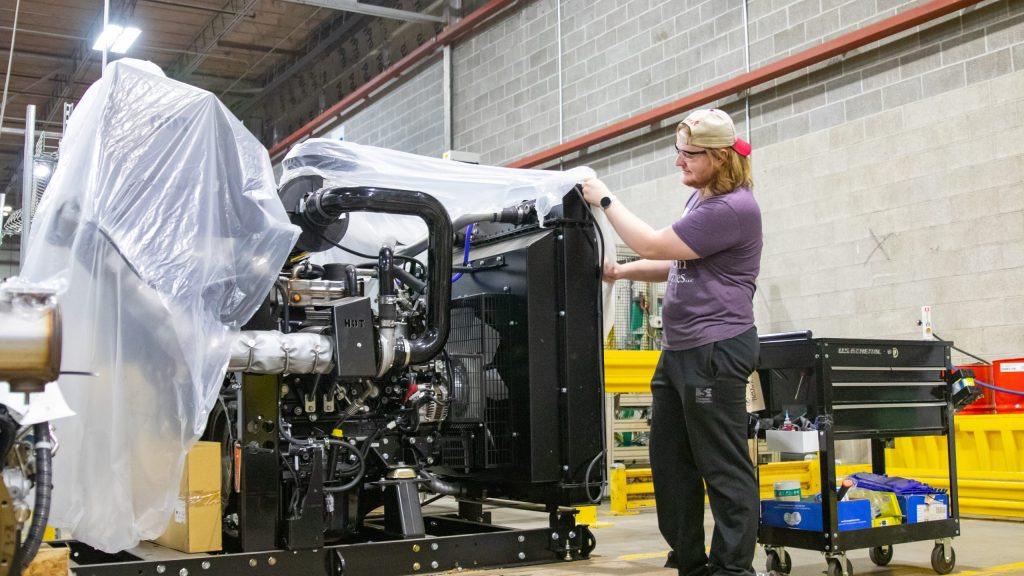 NewStream employee working with equipment